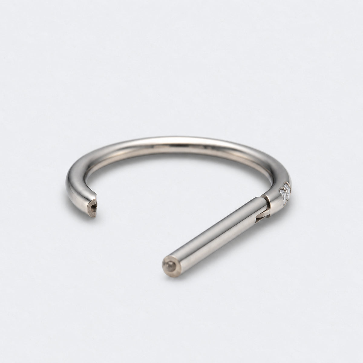 D Shape Half Side CZ Paved Hinged Segment Clicker Ring in Silver - Titanium