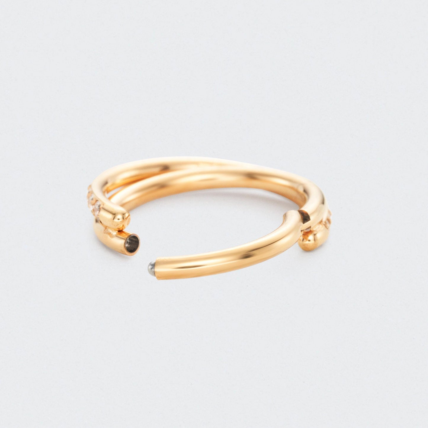 Twisted CZ Side Paved Hinged Segment Clicker Ring in Gold - Titanium