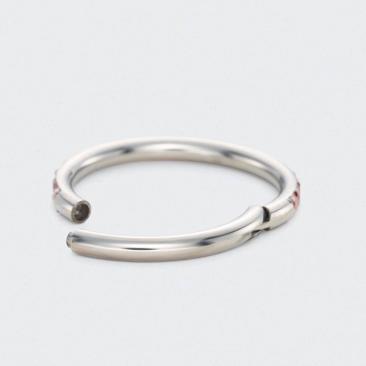 Red CZ Side Facing Paved Hinged Segment Hoop Ring in Silver - Titanium