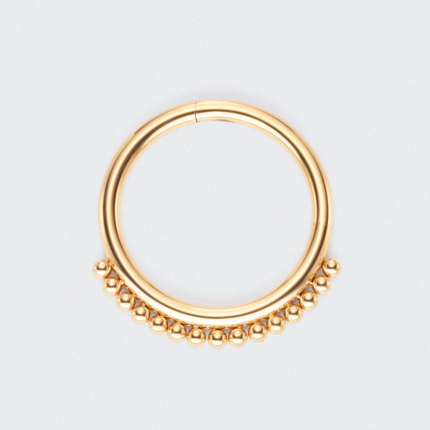 Balls Around Hinged Segment Ring in Gold - Titanium