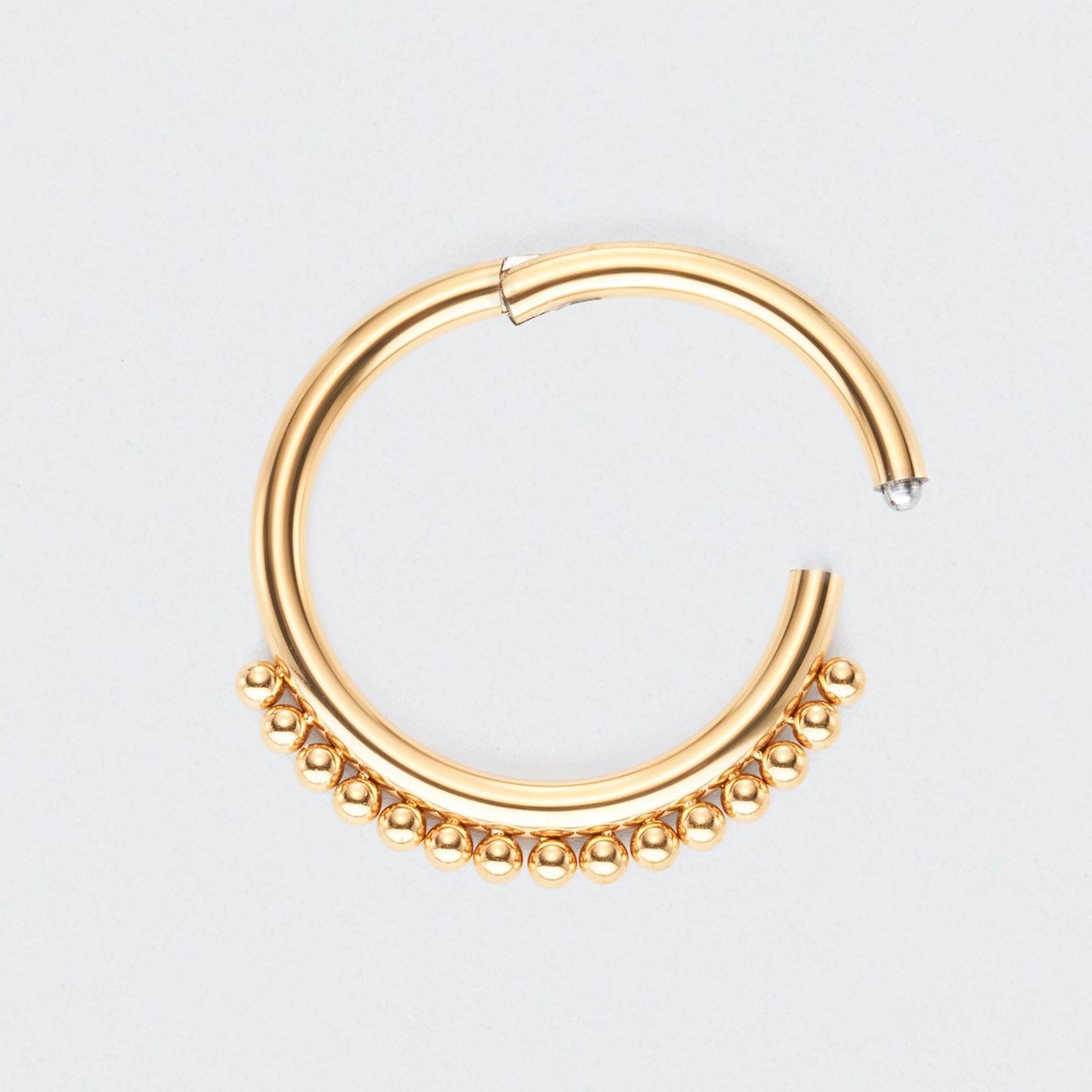 Balls Around Hinged Segment Ring in Gold - Titanium