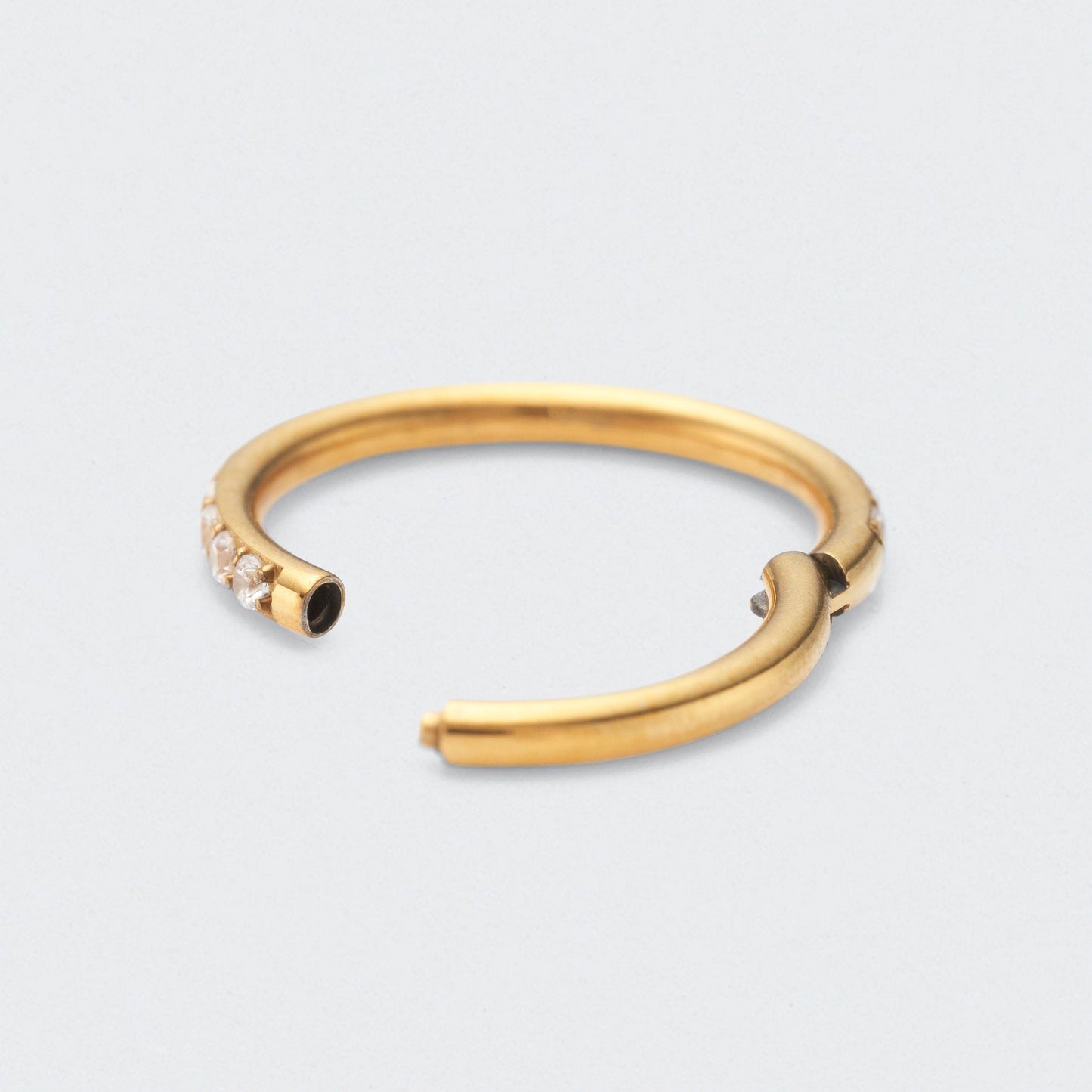 Side Facing CZ Hinged Segment Clicker Ring in Gold - Titanium