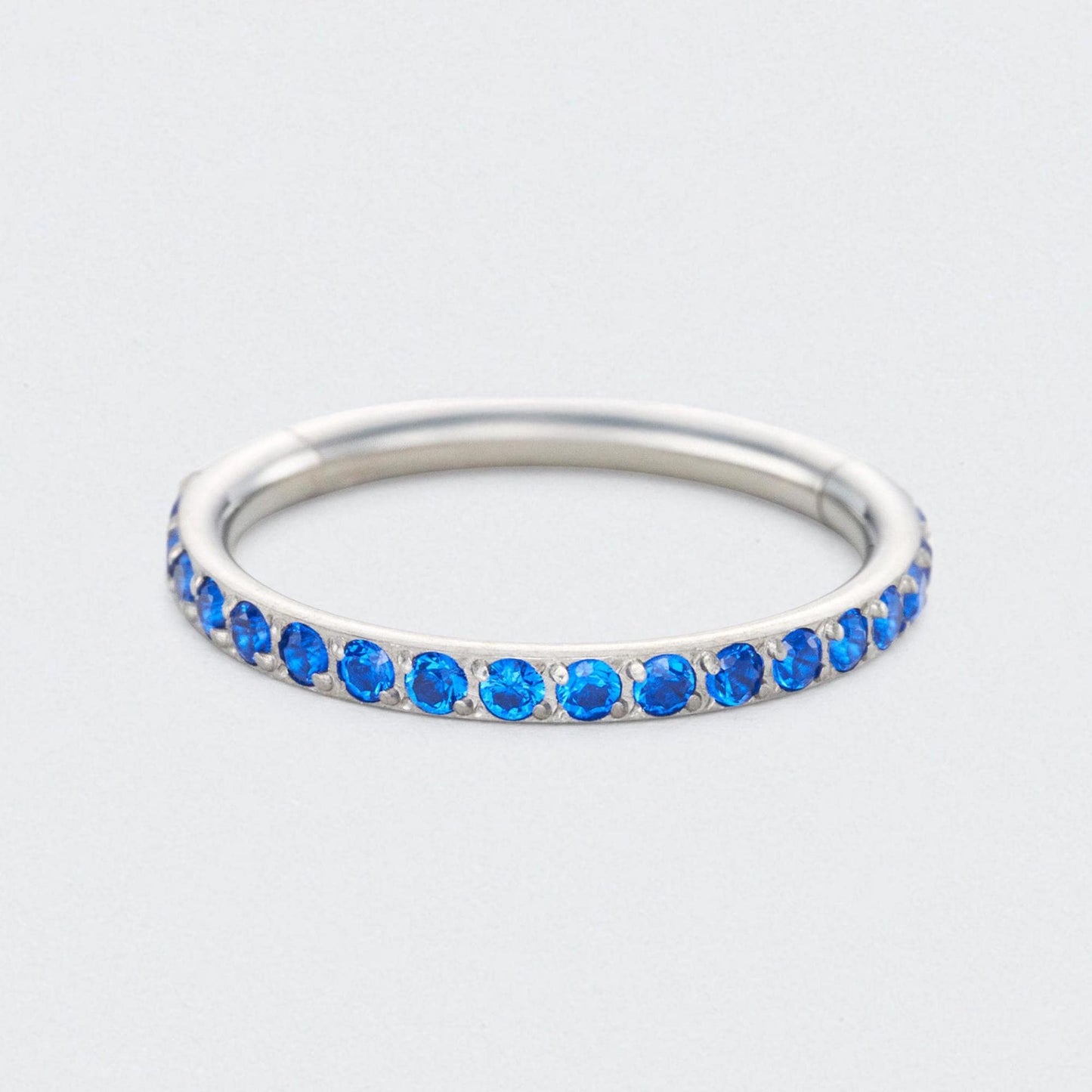 Blue CZ Side Facing Paved Hinged Segment Hoop Ring in Silver - Titanium